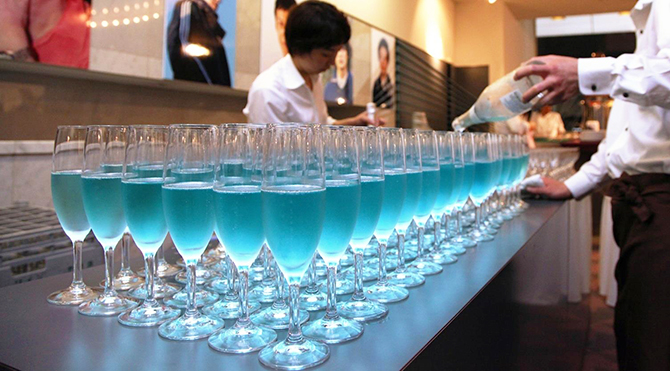 Blanc de Bleu California lgbt wedding rows of wine glasses with blue wine