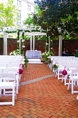 Outdoor ceremony in the colonial brock garden at DACOR Bacon House
