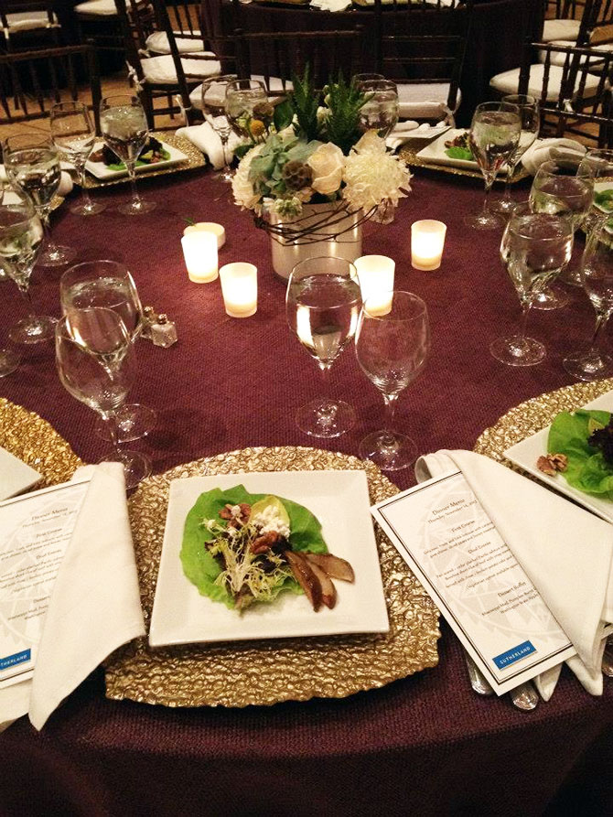 Main Event Caterers - Elegant salad, candlelit table and floral centerpiece