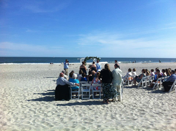 Crystal Mary Us - Wedding ceremony on the beach with guests