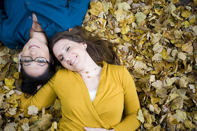 same-sex couple in the leaves - Studio A Images