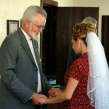LBGT Holy Union - Rev. Paul praying with bride