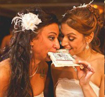 Your Delaware Same-Sex Marriage - Brides feeding each other