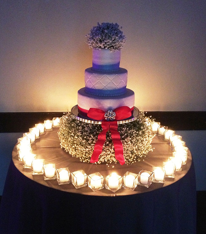 John Michael Weddings & Special Events - wedding cake with baby's breath and fondant bow