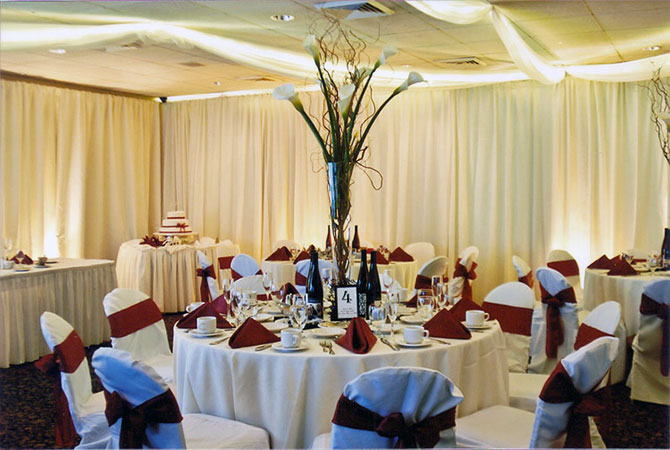 Royal Fiesta Caterers & Event Center - Formal reception seating and large lily centerpiece