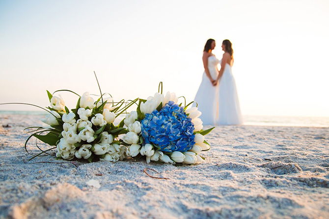 Tide the Knot Beach Weddings - Brides and bouquet on sand