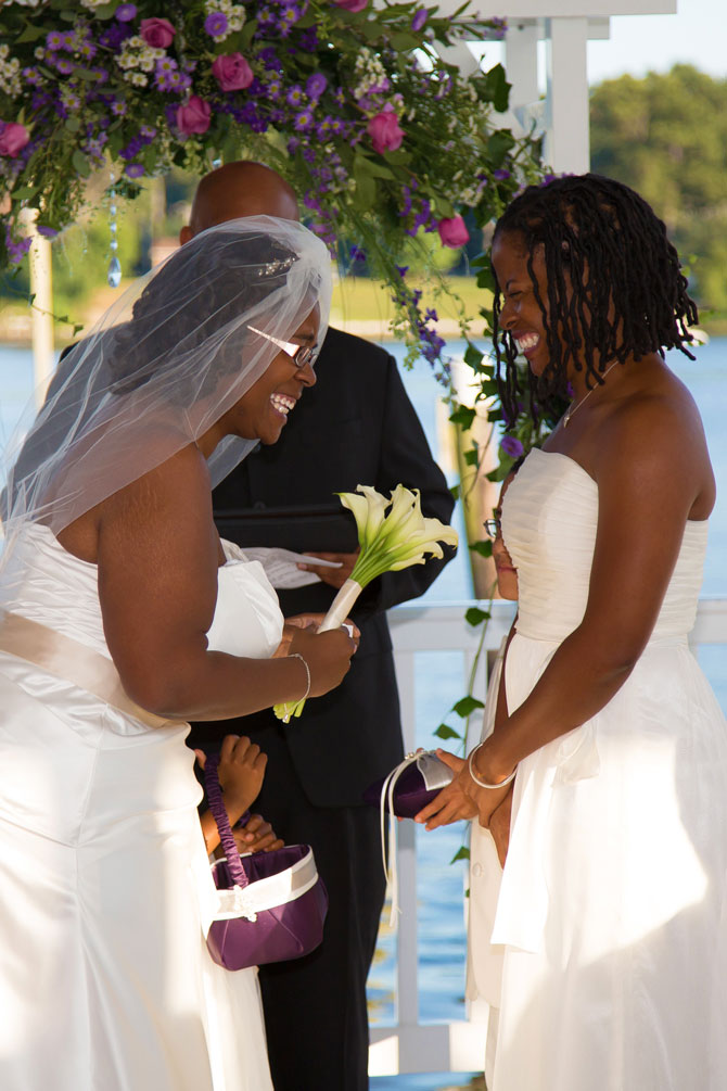 Bayline Studios Photography and Events - Candid Photo of Brides being Married on lake