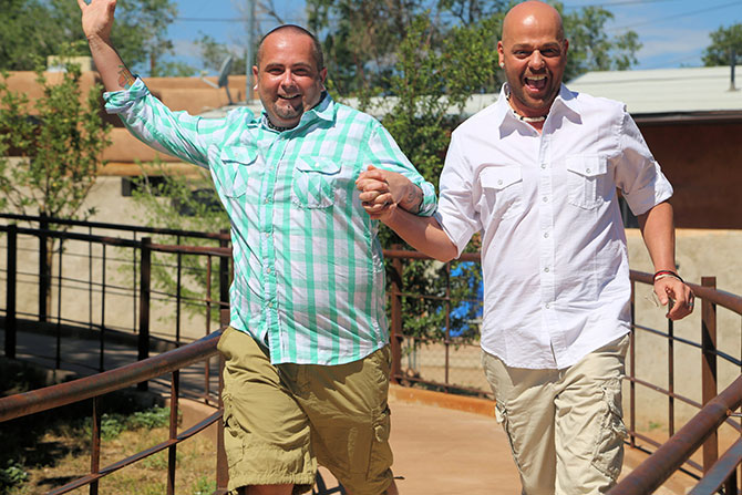 Ricci Photography New Mexico - Gay couple holding hands laughing