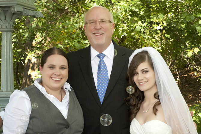 Lesbian marriage ceremony officiated by Reverend Will Mercer in New York City