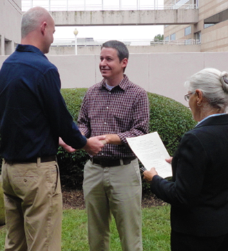 Creative Celebrations - Officiant performing gay wedding ceremony