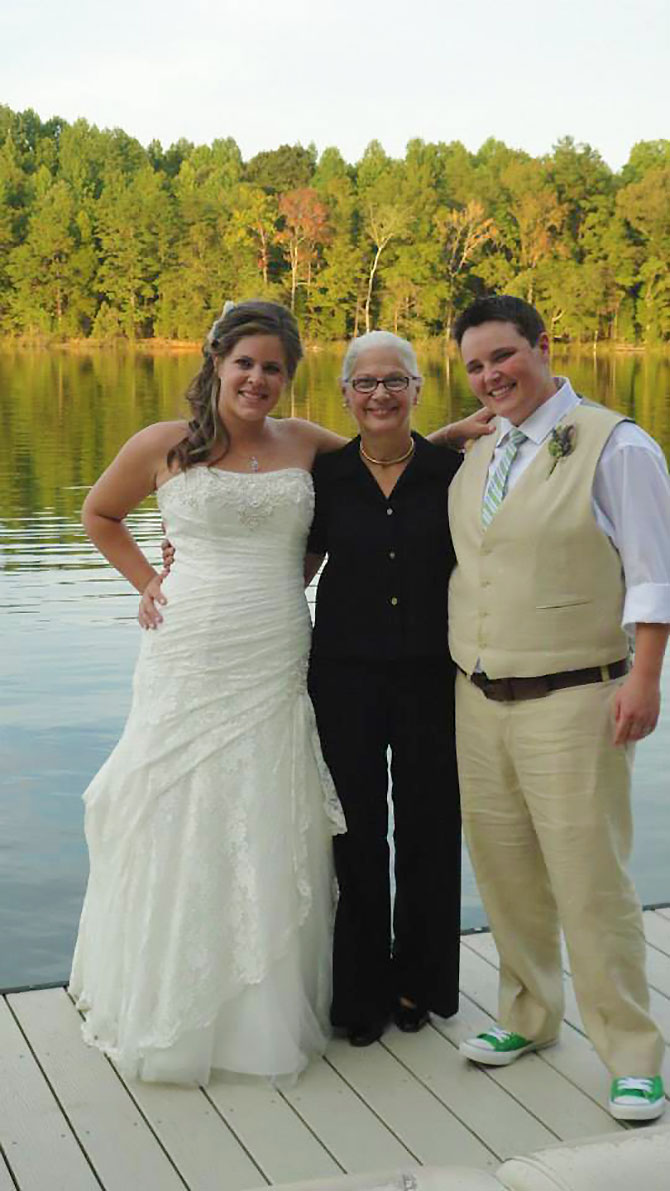 Creative Celebrations - Lesbian Brides with Officiant on a dock