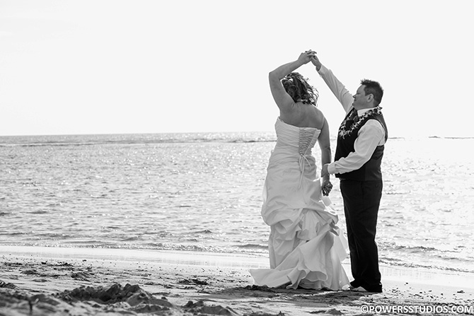 Powers Studios - Black and white image of brides dancing on beach