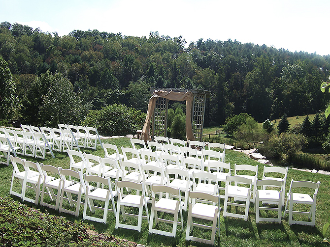 Outdoor wedding ceremony set up with arch in Glasbern Fogelsville, PA