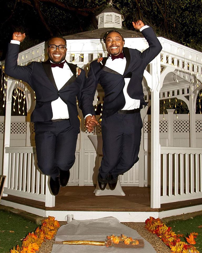 LGBT Couple jumping the broom - Dallas, Texas LGBT Wedding Reception Venue - Jupiter Gardens Event Center
