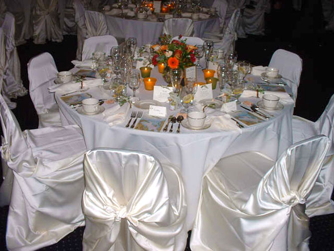 United Party Rental Center - White satin linen table setting