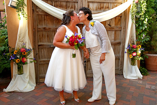 Heritage Hotels & Resorts - Lesbian couple kiss at alter
