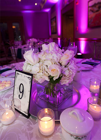 Talamore Country Club - Les Jardins - White rose table centerpiece purple lighting
