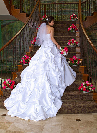 Talamore Country Club - Les Jardins - Rose floral arrangement lining staircase and bride