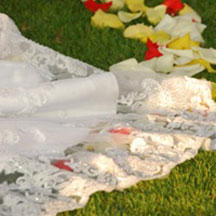 Trinity Hawaiian Weddings - Bridal gown train in flower petals