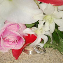 Trinity Hawaiian Weddings - Red rose and white orchids